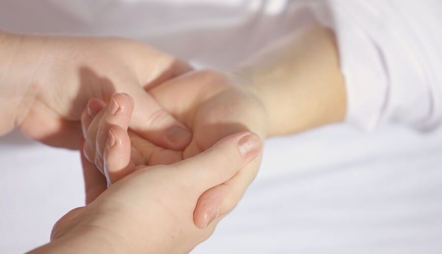 Picture of therapist treating a hand