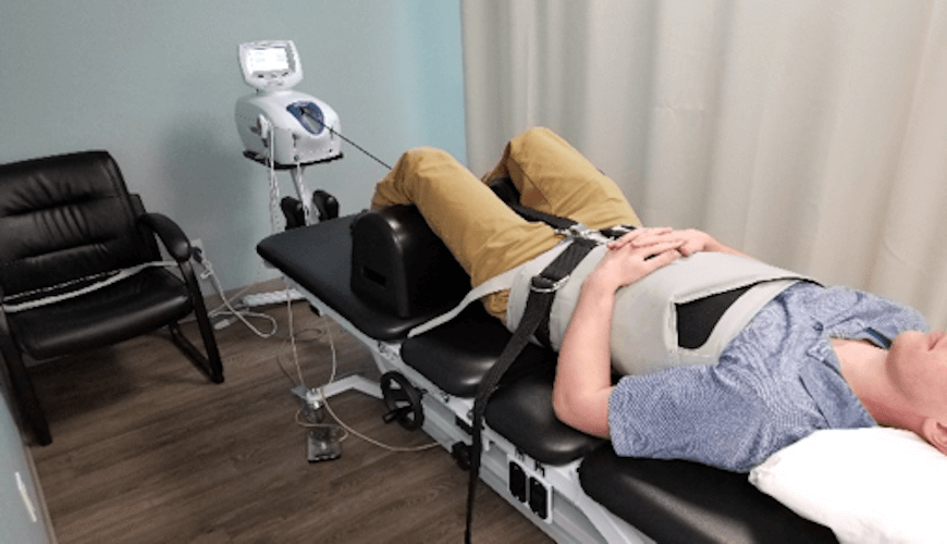 Man lying on Spinal Decompression Table